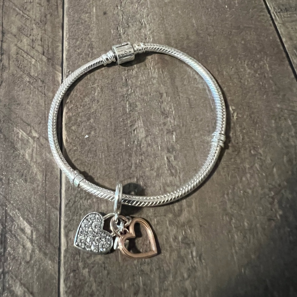 Pandora bracelet with “love” charm.